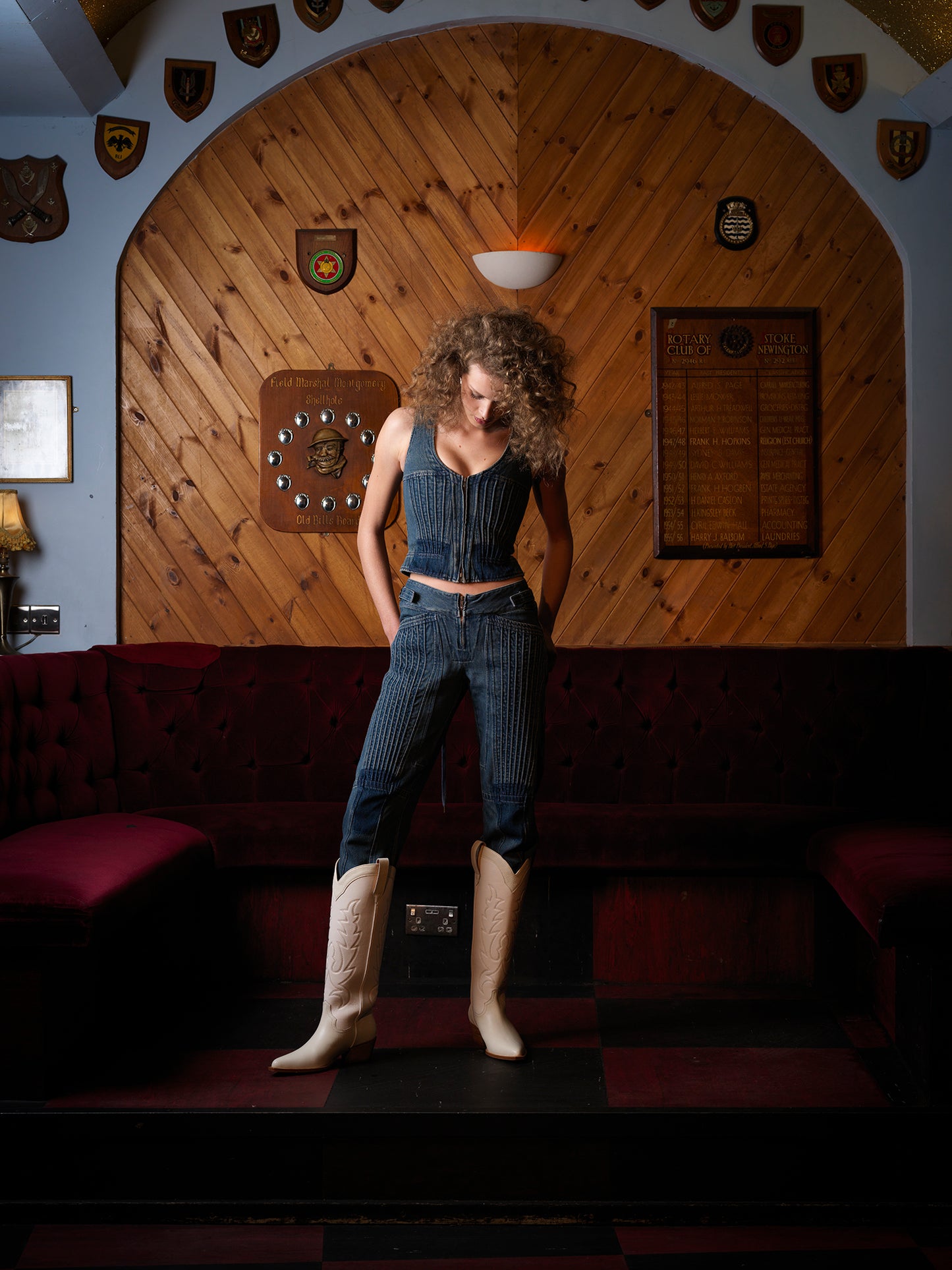 A model in the Moth Club wearing a denim outfit with white leather cowboy boot with embroidered details and a low heel.