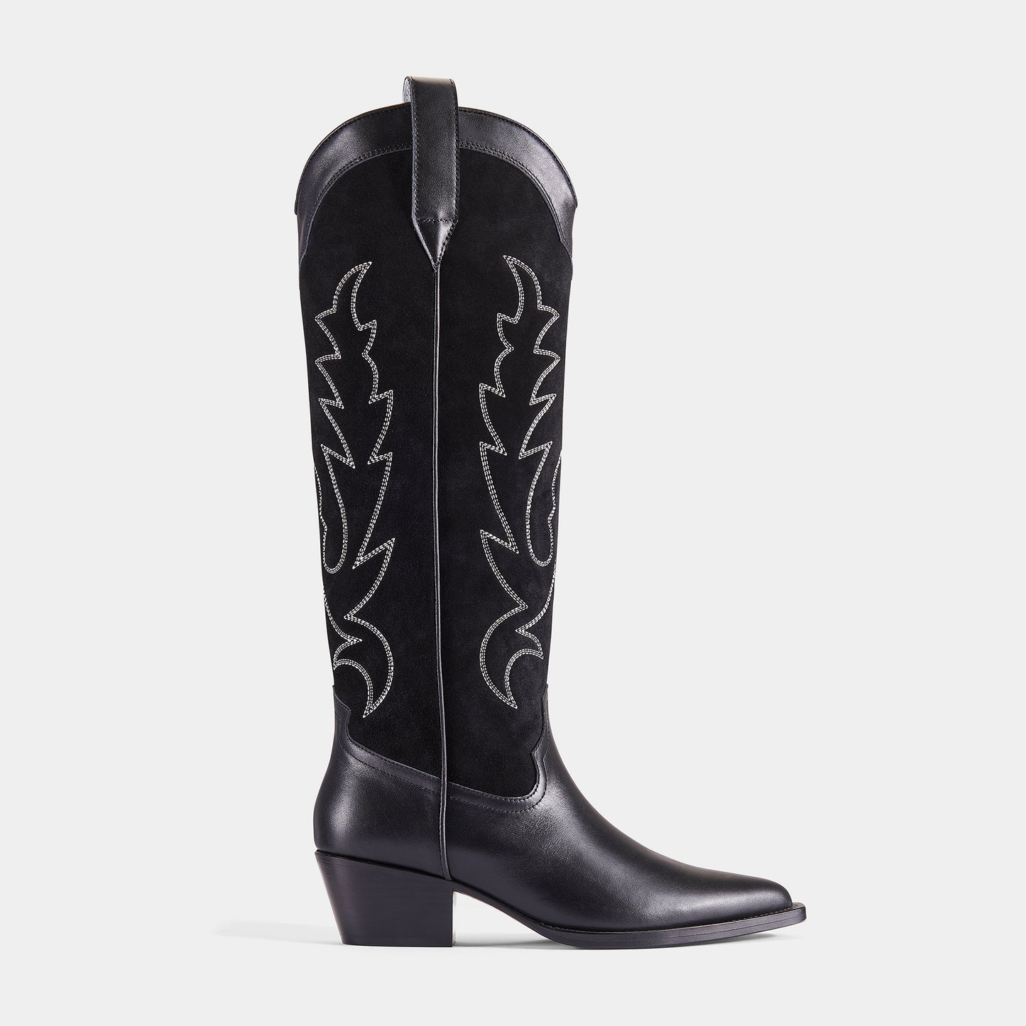 A black embroidered cowboy boot with a pointed toe, embroidered panels, and a low heel - side angle.