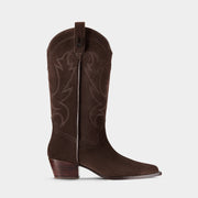 Chocolate brown cowboy boot with logo hardware on a light grey background.