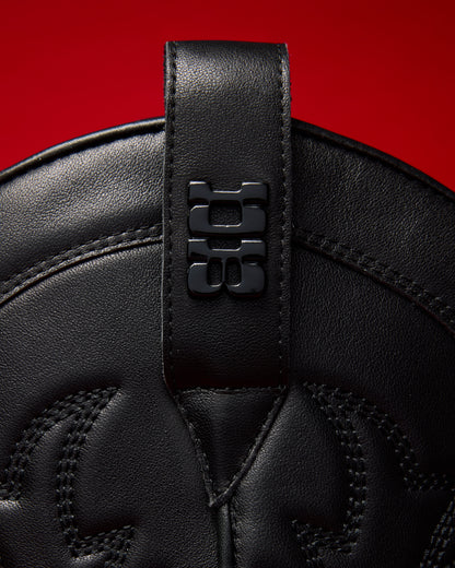 View of logo hardware of Jet Black Cowboy Boot