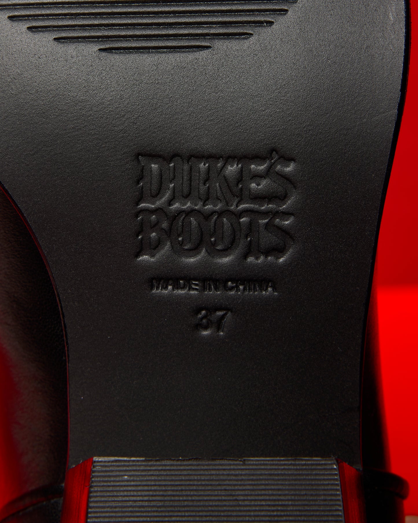 Leather sole of jet black cowboy boot