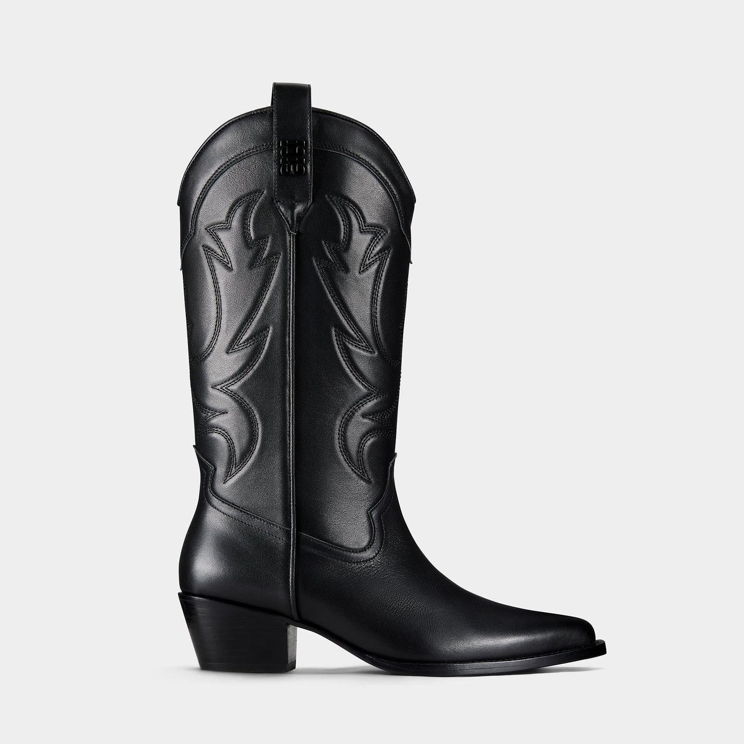 Black cowboy boot with embroidered design and metal branding on a light grey background - side view.