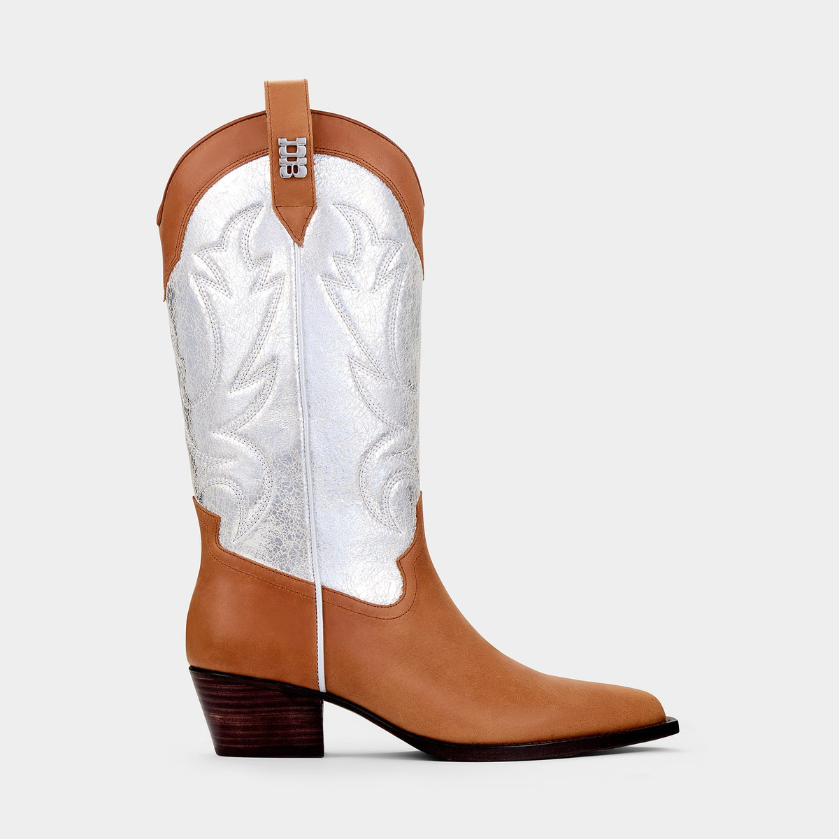 Tan and silver cowboy boot with cracked silver embroidered panels on a light grey background - side angle