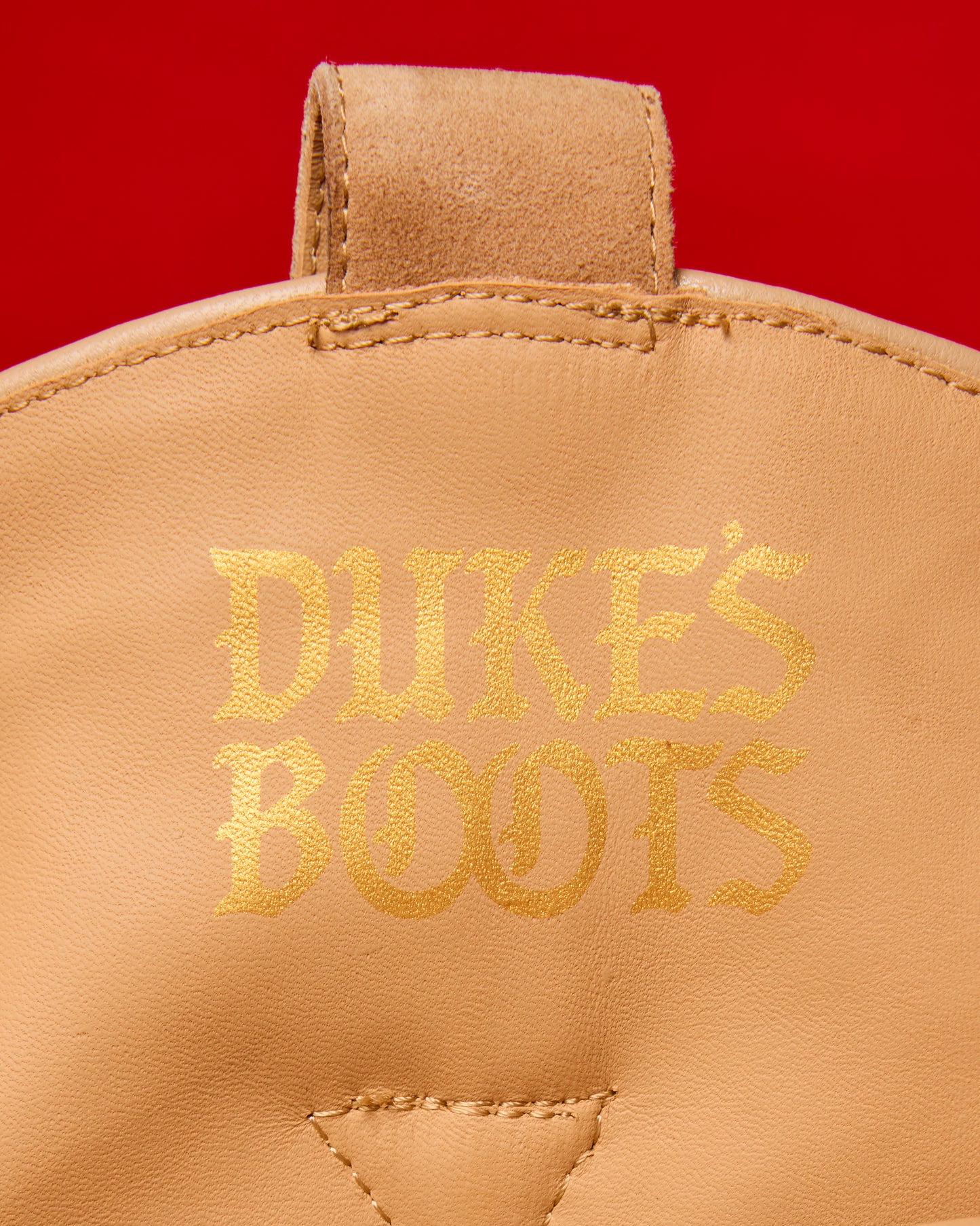 Inner logo of Tan Teddy suede and shearling cowboy boots