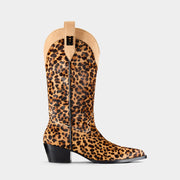 Leopard print cowboy boot on a light grey background - side angle.