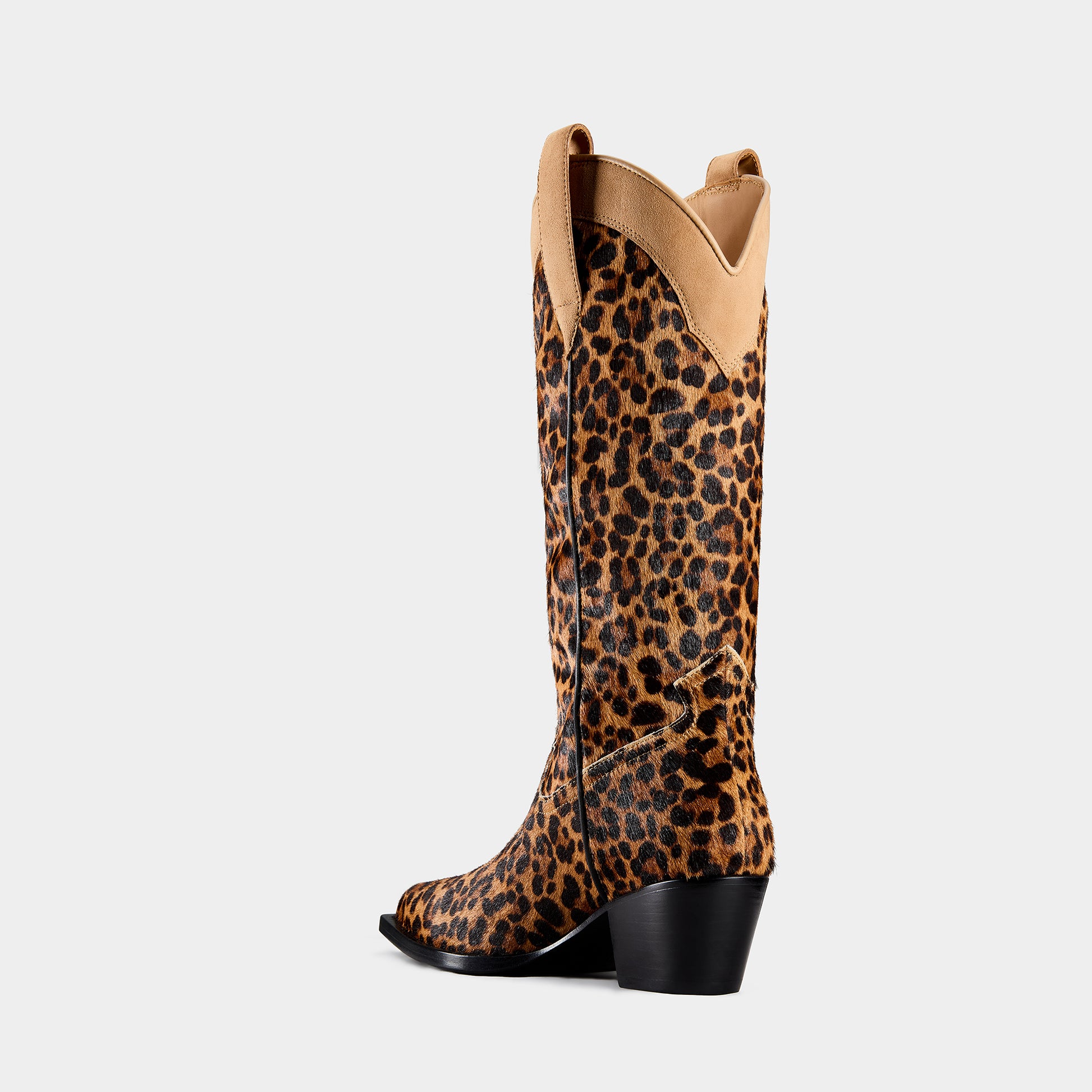 Leopard print cowboy boot with beige top on a light gray background - side angle.