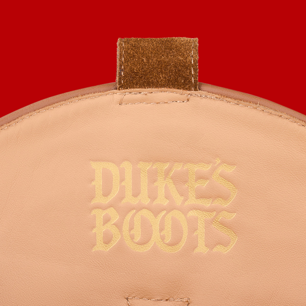 Internal view of wild fawn calf hair cowboy boots with tan lining and gold debossed logo