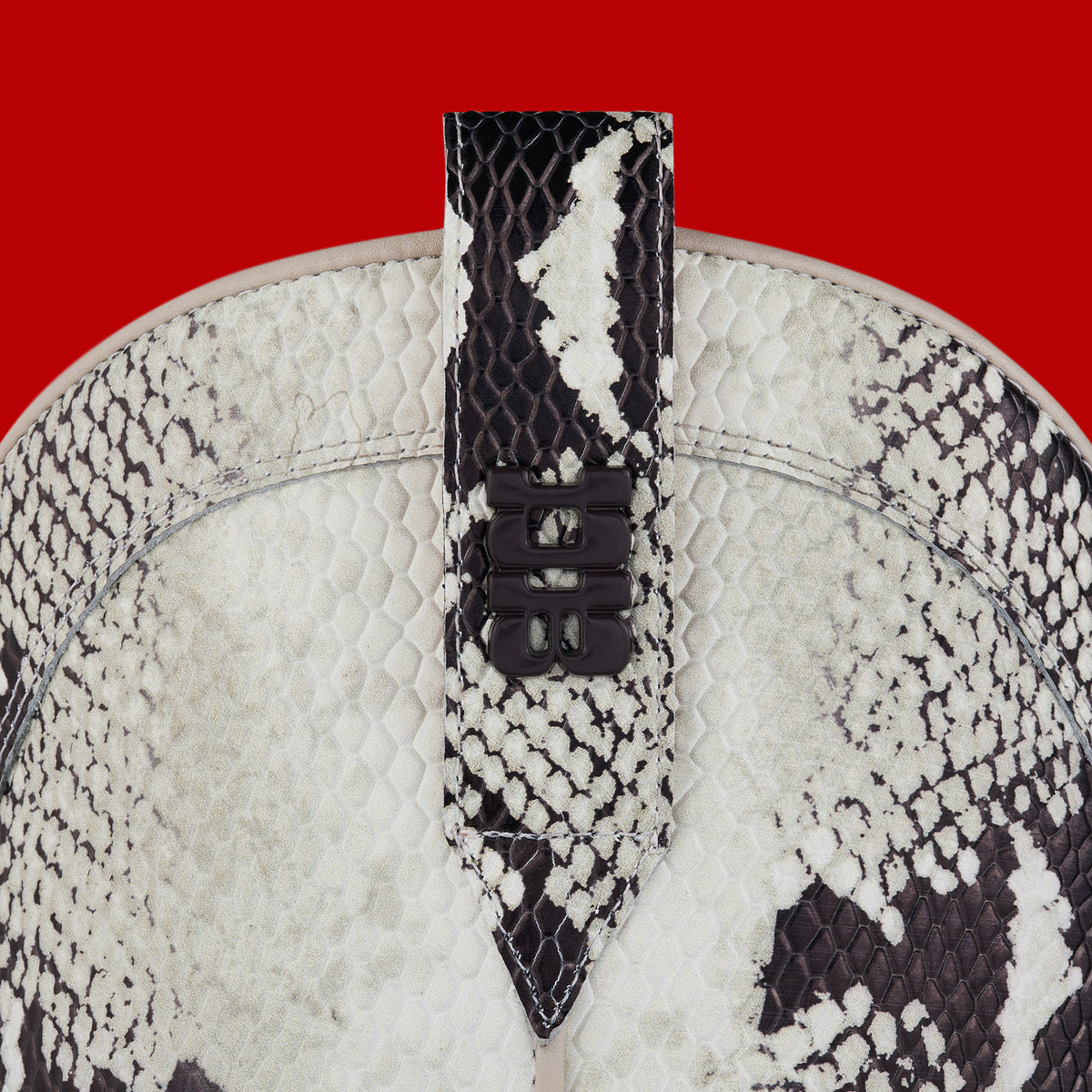 Hardware and puller detail of Tall snake print cowboy boots