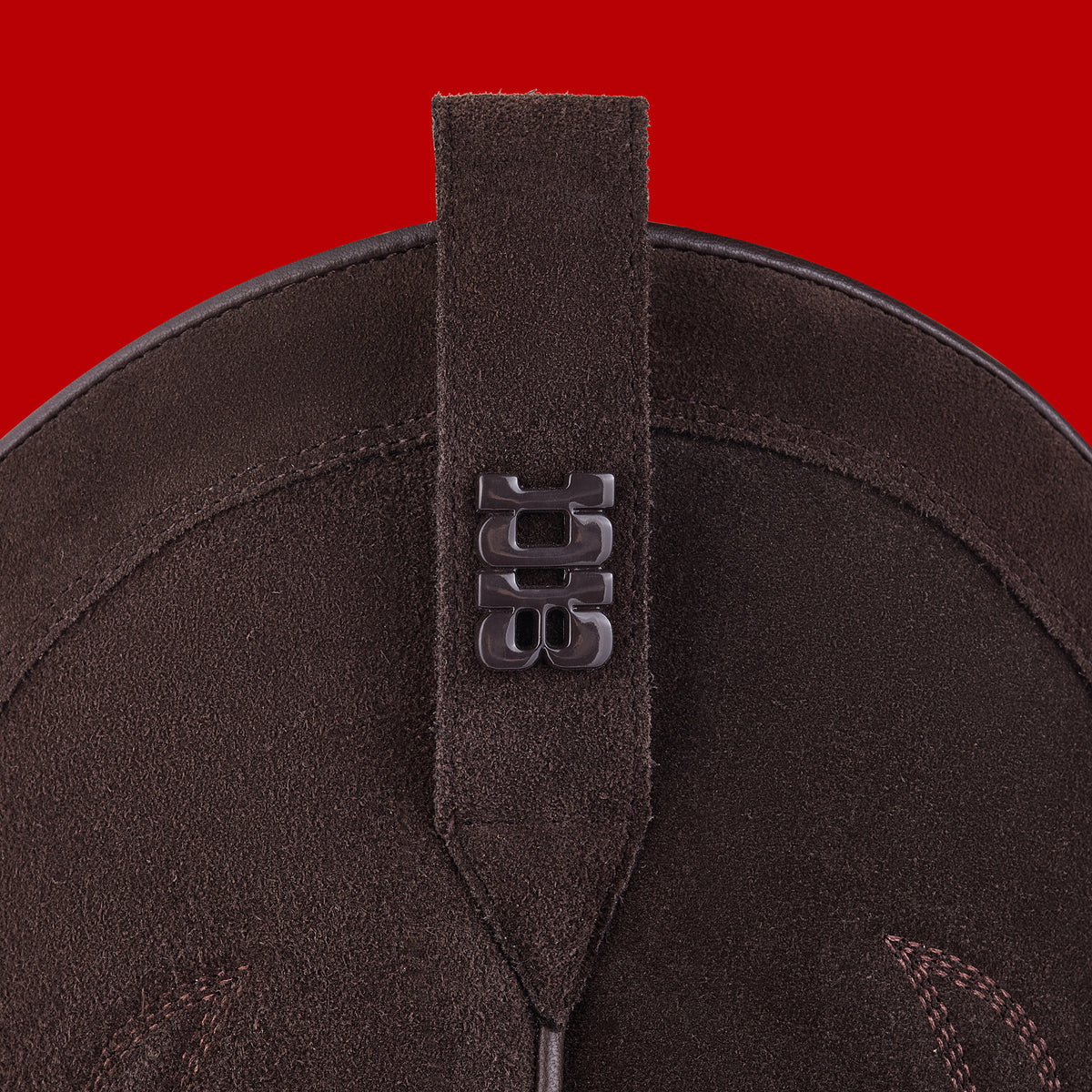Hardware and puller detail of Tall Cocoa suede cowboy boots