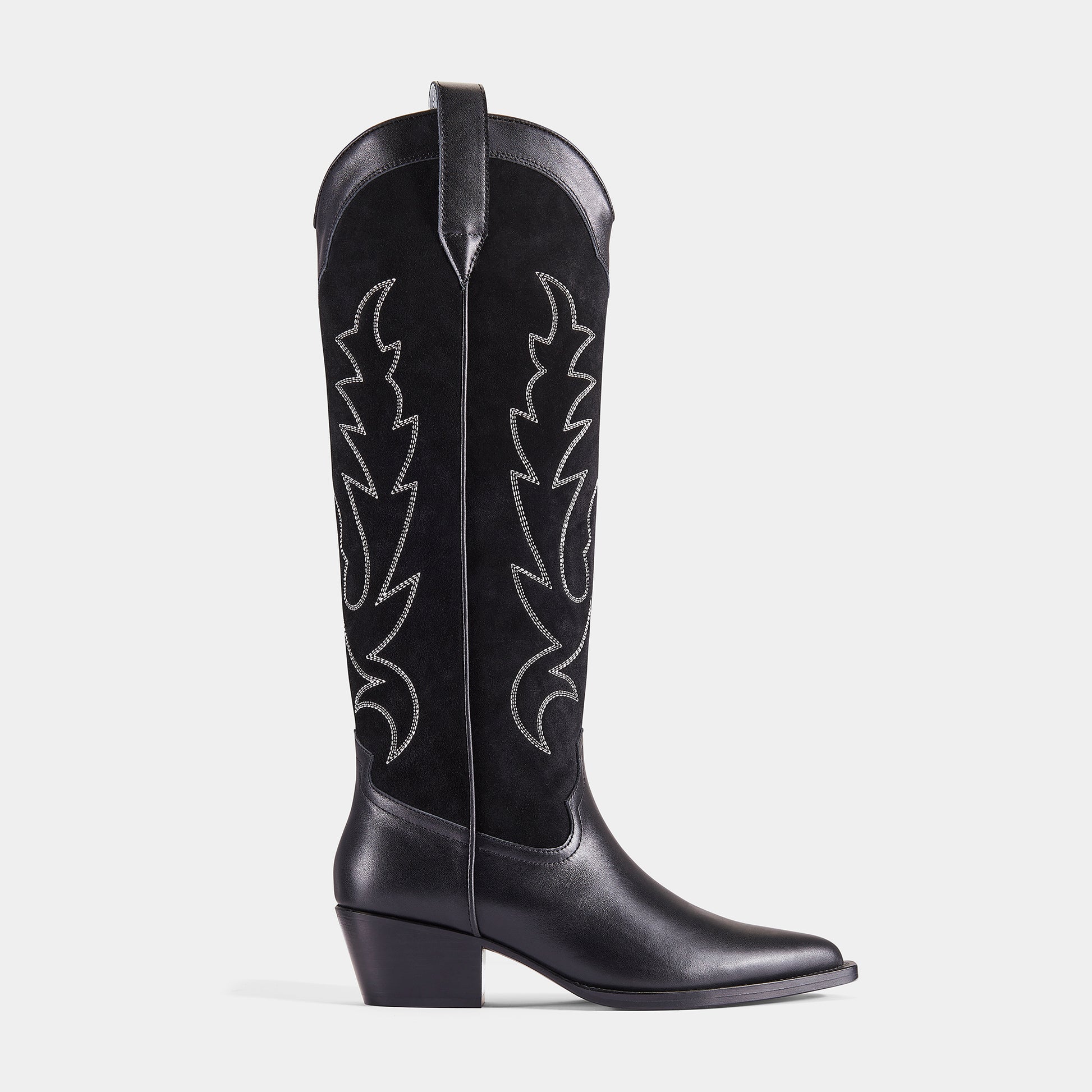 A black embroidered cowboy boot with a pointed toe, embroidered panels, and a low heel - side angle.