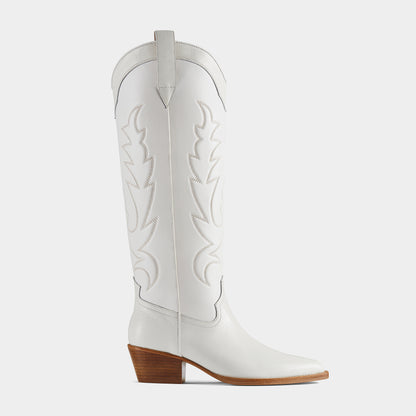 A white leather cowboy boot with embroidered details and a low heel - side view.